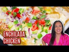 a woman is standing in front of a bowl of chicken and veggie enchilada casserole