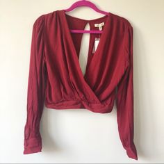 Brand New Long Sleeves Maroon Wrap Top Bought From Urban Outfitters. Features An Open Back With A Button At The Bottom. Slightly Cropped Fit. New With Tags! Trendy Urban Outfitters Blouse For Fall, Fitted Blouse From Urban Outfitters For Fall, Casual Cropped Blouse For Date Night, Fitted Fall Blouse From Urban Outfitters, Fitted Urban Outfitters Blouse For Fall, Urban Outfitters Tops For Night Out In Spring, Trendy Urban Outfitters Fall Blouse, Urban Outfitters Blouse For Day Out In Fall, Urban Outfitters Tops For Spring Night Out