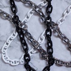 Details Heavy duty metal hardware chain with a hoop on one end and closures on both ends for easy attachment. The perfect accessory for all of your streetwear outfits--just clip it onto any belt loop or hoop. 25" total length. 0.75" length links. Made with heavy duty iron alloy. Black and white variants are coated with respective color glossy paints that will wear down over time for a distressed aesthetic. Description We heard you were looking for more streetwear accessories to pair with your fa Aesthetic Description, Edgy Outfit, Glossy Paint, Streetwear Accessories, Edgy Outfits, Chain Link, Spice Things Up, Peppermint, Silver Chain