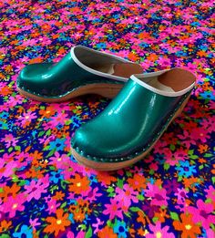 "This listing is for an incredibly groovy and unique pair of vintage 70s Bastad-Joffeln Made in Sweden shiny green clogs! Such a spunky pair of clogs - a real showstopper! These totally great vintage clogs are in excellent vintage condition, showing some age-appropriate signs of general wear and tear. There are a few scuffs, here and there and some wear to the rubber souls, but overall, considering their age they are in great shape and still have a lot of life to live! These are marked as a size Vintage Clogs, Rubber Soul, Swedish Clogs, Clogs And Mules, Blue Hawaiian, Vintage Maxi Dress, Vintage Candles, Clogs Shoes, Womens Clogs