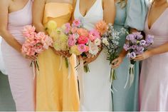 the bridesmaids are holding their bouquets in different shades of pink and yellow