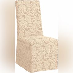 an upholstered chair with a beige floral pattern on the back and seat cover