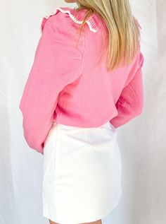 This fun and flirty sweater is perfect for any girly-girl who loves pink. With its ruffled accents and Barbie-pink hue, this sweater is sure to turn heads. Dress it up with a white skirt or dress it down with lightwash jeans. Either way, you'll be getting compliments left and right. Pink Long Sleeve Sweater With Ribbed Cuffs, Pink Spring Tops With Ribbed Cuffs, Trendy Pink Sweater With Ruffles, Chic Pink Spring Sweater, Chic Pink Sweater For Spring, Cute Long Sleeve Sweater With Ruffles, Pink Ruffled Tops For Winter, Pink Ruffled Sweater For Winter, Pink Ruffled Winter Top