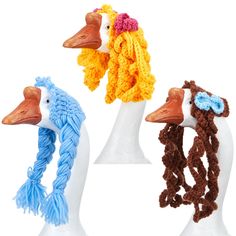 three crocheted ducks wearing hats and scarves on their heads, one with a scarf around it's neck