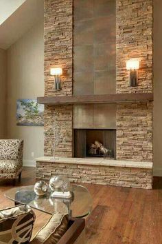 a living room filled with furniture and a fire place in the middle of a room