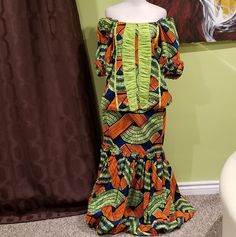 Beautiful 2 Piece African Print Skirt Set Has Lining Has Slight Stretch Has Zipper On The Back Of The Top And Skirt Size: One Size. Mannequin Size: 2-4 Top Width: 42" Skirt Width: 31" Skirt Length: 39" Colors: Bright Orange, Dark Blue, Lime Green, White, And Black Details: Has Balloon Style Sleeves And A Bubble Skirt Bottom. Some Of The Blue Has Bled Into Various Parts Of The Outfit, Which Is Similar To What Is Seen In The Photos. African Top And Skirt, African Tops, African Print Skirt, Maid Of Honour Dresses, Bubble Skirt, Top And Skirt, Print Skirt, Bright Orange, Maid Of Honor