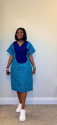 Be fashionably adorned in this gorgeous shift dress with  side pockets and made with 100% African wax cotton As always our designs are fully handmade, comfortable and perfect fit to suit all body types. Please feel free to inform us about any customization options or preference.  We will proceed with selected standard UK  / customized size within 12 - 24hours of purchase Model is wearing size 8 (Small) Please DM your custom measurement if you have it. Waist Bust Length  Round Arm   Please see ou Ankara Shift Dresses For Women, Ankara Free Dresses For Women, Cotton Shift Midi Dress With Pockets, Cotton Shift Dress With Pockets, Cotton Shift Dress With V-neck, Cotton V-neck Shift Midi Dress, Cotton Midi Dress With Side Pockets, Blue Cotton Dress With Pockets, Blue Cotton Midi Dress With Pockets