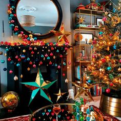 a living room decorated for christmas with decorations