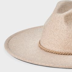 Give your hat collection a chic, versatile update with this Wide-Brim Fedora Hat from Universal Thread™. Made from woven recycled polyester fabric, this fedora hat is designed with a wide brim that measures 22.5 inches in circumference. Great for accenting a wide variety of outfits, it also offers an adjustable fit with the hook-and-loop fastener. Universal Thread™: Found exclusively at Target. Lightweight Fedora Hat, Lightweight Fedora With Curved Brim, Casual Beige Wide Brim Felt Hat, Casual Beige Felt Hat With Curved Brim, Beige Casual Panama Hat For Fall, Casual Beige Panama Hat For Fall, Trendy Beige Fedora With Curved Brim, Lightweight Beige Fedora With Short Brim, Lightweight Beige Fedora With Flat Brim