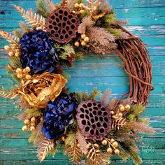 a wreath with blue and gold flowers on it