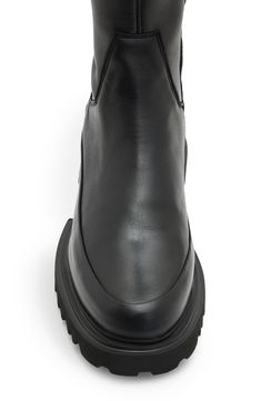 A lug sole adds just the right touch of utilitarian attitude to this streamlined over-the-knee boot. 1 1/2" heel 23 1/2" shaft; 15 1/2" calf circumference Inset side-zip closure Leather upper and lining/synthetic sole Made in Portugal Over The Knee Leather Boots, Knee Leather Boots, Dramatic Silhouette, Leather Over The Knee Boots, Leather Boots Black, Black Trainers, Chunky Block Heels, Lug Sole, Black Leather Boots