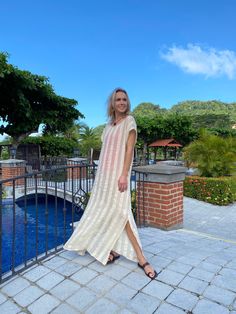 Whether you will wear it as an over-bikini cover-up, or as a dress on its own, you will be able to achieve an elevated look with our Collette Kaftan. Delicate and sophisticated, this linen kaftan will be a perfect fit at a resort by the sea, or at any poolside setting. You can also wear it as a tunic over a slip dress, shorts and even jeans. Collette Kaftan is one size. Due to its breathable transparency, you can purchase it together with our Leah cotton slip dress, that is available in sizes S, Beige V-neck Linen Dress For Beach, Chic V-neck Linen Dress For Beach, Chic V-neck Linen Beach Dress, V-neck Linen Dress For The Beach, Beachwear Maxi Dress With Side Slits For Beach Cover-up, Beachy Beige Maxi Dress For Vacation, Long Beige Dress For Beach Season, Linen Maxi Dress For Beach Cover-up, Vacation Linen Maxi Dress