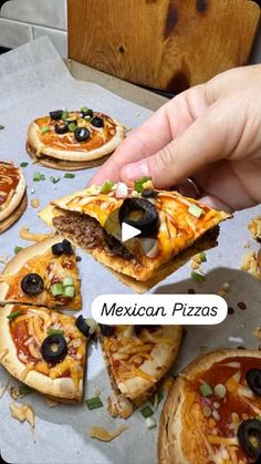 a person is cutting into some pizzas on a sheet of wax paper with the words mexican pizzas above them