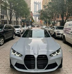 a grey car parked on the side of a street