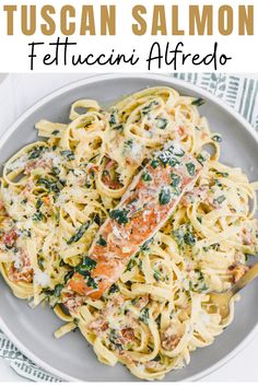 plate of salmon and Alfredo Salmon Spinach Fettucini Alfredo, Fettucini Pasta Recipe, Tuscan Salmon Pasta, Salmon Alfredo Pasta, Salmon Alfredo