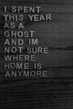 a sign on the side of a building that says, i spent this year as a ghost and i'm not sure where home is anymore