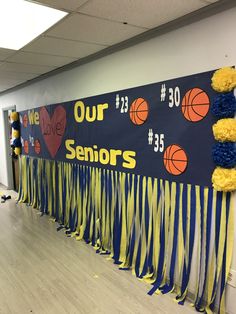 this is an image of a school hallway decorated for senior's day with basketballs and streamers