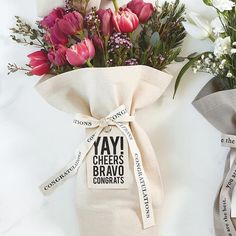 a bouquet of flowers is wrapped in a bag