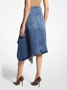 Imbued with an architectural edge, this denim skirt features asymmetrical, cascading ruffles that descend to a flattering knee-grazing length. Italian-made, this skirt is crafted from organic cotton for an effortless drape and soft handle. Wear it with a leather belt to further define the high-rise waist. Asymmetrical Cotton Denim Skirt, Modern Asymmetrical Hem Bottoms For Spring, Modern Asymmetrical Hem Skirt For Spring, Modern Skirt With Asymmetrical Hem For Spring, Modern Asymmetrical Skirt For Fall, Chic Asymmetrical Fitted Denim Skirt, Chic Fitted Asymmetrical Denim Skirt, Fitted Chic Asymmetrical Denim Skirt, Chic Asymmetrical Denim Skirt For Fall