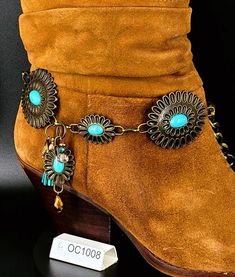 The Octavie collection is intended to be showy and sometimes exuberant. It is composed according to the model of metal pellet of different color, finish and size. According to my inspiration, I add charms, suede tassels and assembly of glass beads. These are assembled one by one to match the entire set. It can be worn over a cowboy boot as well as a more chic boot, or even an ankle boot. You will definitely give yourself a unique style by wearing this beautiful jewelry on your boots or booties. Bohemian Bronze Jewelry For Party, Handmade Western Style Gold Jewelry, Handmade Western Gold Jewelry, Nickel Free Bronze Jewelry, Bohemian Jewelry Chain As Fashion Accessory, Bohemian Jewelry With Chain, Metal Charms Jewelry For Accessorizing, Adjustable Bronze Chain Jewelry, Western Style Gold Jewelry As Gift