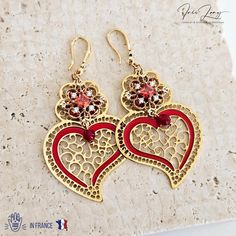 Viana heart earrings (Viana do Castelo - the city from Portugal where the origin of this heart shape was created), featuring a filigree work in gold steel, thin and lightweight drop earrings, 925 sterling silver wires with zirconia stones, nickel and lead free, made in an intricate detail, with red enamel curves and geometric charms, in a baroque style. ∙ DESCRIPTION & MATERIALS ∙ * Material: Stainless steel and filigree cut, 925 sterling silver ear wires, CZ zirconias * Featuring a 6.3 cm x 3.3 Heart Earring, Baroque Style, Jewelry Birthday, Free Earrings, Birthday Jewelry Gift, Baroque Fashion, Silver Earring, 925 Sterling Silver Earrings, Last Minute Gifts