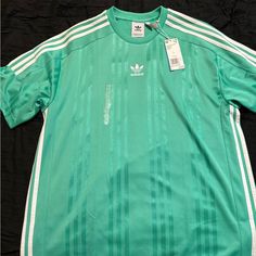 Brand New Never Worn Adidas Jersey Casual Green Adidas Tops, Green Casual Top With Three Stripes, Casual Green Top With Three Stripes, Adidas Green Short Sleeve Tops, Adidas Green Top For Spring, Adidas Green Long Sleeve Top, Adidas Green Crew Neck T-shirt, Adidas Long Sleeve Green Top, Green Adidas Crew Neck T-shirt