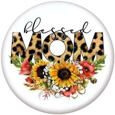 a button with the word mom written in leopard print and sunflowers on it