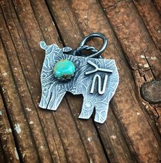 This listing is for one (1) .925 sterling silver animal charm with a genuine Kingman turquoise stone. The charm measures roughly 1" wide. This charm comes on an 18" .925 sterling silver chain.&#9728 !!!PLEASE LEAVE TWO RELIABE FORMS OF COMMUNICATION IN THE DESCRIPTION BOX INCASE I NEED TO CONTACT YOU ABOUT YOUR ORDER!!! &#9728CLEANING:     To clean your pieces, gently wipe them with a polishing cloth. Using chemicals is not recommended. I also offer complimentary cleaning, and/or antiquing (not Western Style Silver Turquoise Necklace As Gift, Personalized Western Silver Jewelry, Personalized Western Style Silver Jewelry, Personalized Silver Western Jewelry, Western Sterling Silver Turquoise Pendant Necklace, Western-style Sterling Silver Turquoise Pendant Necklace, Western Style Turquoise Pendant Necklace In Sterling Silver, Turquoise Sterling Silver Jewelry With Charms, Western Style Pendant Jewelry For Gift