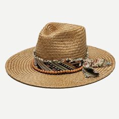 Inspired by the laidback Southern California lifestyle, Wyeth sun hats, wool felts, and caps offer modern takes on classic designs. Handmade with materials including natural 100% raffia straw, genuine suede leather, and soft Australian wool felt, Wyeth’s versatile hats are the go-to for those with an eye for both quality and style. Our Kassia panama straw rancher features a thick woven pattern band that is finished with raw edges, a bow, and prayer beads. Bonus: You can customize the fit using t Raffia Hat, Rancher Hat, Pink Beanies, Anthropologie Accessories, Anthropologie Brands, Summer Sun Hat, Sun Protection Hat, Wool Berets, Woven Pattern