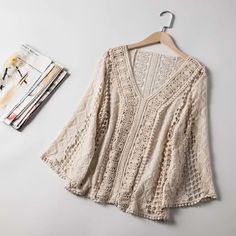 Women's Wholesale New V-neck Lace Hollowed-out Hook Pullover Shirt on Luulla Fall Crochet V-neck Top With Crochet Trim, Chic Cream V-neck Crochet Top, Bohemian White Hollow Out Top, Summer Crochet Lace V-neck Top, Casual V-neck Lace Top With Lace Sleeves, Summer V-neck Hollow Out Top, Cream V-neck Top With Crochet Trim, Spring Hollow Out Lace Crochet Top, Spring Lace Crochet Top With Hollow Out Details