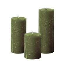 three green candles sitting next to each other