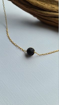 "Pele's Choker Necklace You can customize this black lava necklace to suit your personal style with your choice of sterling silver, 14k gold filled or 14k rose gold filled material. The model is wearing the 15\" length chain. D E T A I L S * Lava Bead Size: Approx 8mm * Chain Length: 14\" to 20\" For use with essential oils, add a drop or two of your favorite 100% pure therapeutic grade essential oil on to the lava beads, allow it soak in and enjoy the aromatherapy! Lava rocks are very porous an Elegant Adjustable Lava Stone Jewelry, Black Lava Stone Necklace For Gift, Minimalist Adjustable Lava Stone Jewelry, Everyday Spiritual Lava Stone Jewelry, Elegant Black Lava Stone Jewelry, Adjustable Hypoallergenic Black Necklace, Adjustable Black Minimalist Charm Necklace, Black Adjustable Minimalist Charm Necklace, Black Hypoallergenic Necklace As A Gift