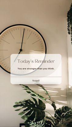 there is a clock on the wall next to a sign that says today's reminder