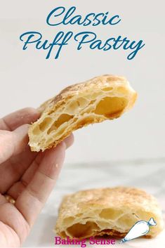 a hand holding a biscuit with the words classic puff pastry