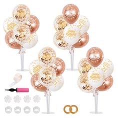 the balloon bouquet is filled with gold and white confetti, balloons, and wedding rings