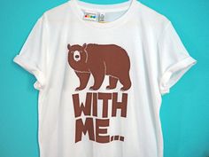 "Bear with me... We do love a good animal pun! This unisex t-shirt has our own original cute and fun design hand screenprinted on to it. We designed the typeface ourselves too and it is big and chunky (like the bear!) and has a nice 'woody' rustic quality. This is the perfect style of t-shirt for the men out there but is equally lovely for women to wear as a slightly oversized style. SIZES: Please refer to our handy size chart in the images for the full measurements. SMALL: Chest 39 1/2 inches ( Animal Puns, Bear With Me, Funny Bears, Funny Tshirt, Tshirt Funny, Boyfriend T Shirt, Bear T Shirt, Oversized Style, Animal Tshirt