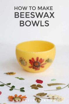 a yellow bowl sitting on top of a white table next to flowers and text that reads how to make beeswax bowls