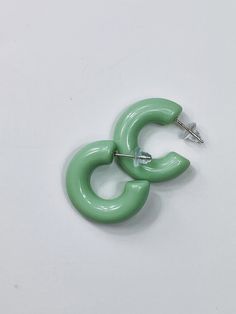 These earrings are made of resin. The earrings are lightweight and easy to wear. As you can see, the earring backs are silicone. I chose them for comfort in mind. I decided to make the color mint green because it's powerful and quiet. Mint green can be dressed up and down to stand out. The hoop width is 1 1/2 inches wide. The stud is made out of silver. Unfortunately, this piece is not hypoallergenic. Ceramic Beads Necklace, Yellow Necklace, Jewelry Outfit, Evil Eye Necklace, Yellow Leather, Ceramic Beads, Eye Necklace, Polish Jewelry, Gorgeous Necklaces