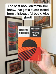 a person holding up a book in front of a wall with pictures on it and the caption reads, the best book on feminist know i've got a quote stated from this beautiful book