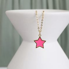 "Beautiful and lovely pink star charm necklace.  Made of dainty neon pink enamel star charm with skinny gold plated brass chain.  The simple and natural-looking dainty necklace is good for yourself or gift! Your necklace will ship in a rudiana gift box. ♥ Gold Plated over Brass / Neon pink enamel ♥  Chain length 14\" - 20\"   ♥  Pink star charm 1/2\"   ♥  Creation Time: 1 - 3 days  ♥ US shipping transit time: 3-5days    ♥  See more Rudiana Accessories  Rudiana.etsy.com" Dainty Pink Charm Necklace With Adjustable Chain, Dainty Pink Charm Necklace With Delicate Chain, Pink Star Charm Jewelry, Trendy Pink Jewelry With Star Charm, Trendy Pink Necklace With Star Charm, Trendy Pink Star-shaped Jewelry, Pink Star Charm Jewelry For Gift, Cute Pink Jewelry With Star Charm, Pretzel Necklace