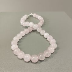 Product Description: Item Code: SGH-979 Stone Name: Rose Quartz Size: 10MM Shape: Smooth Round Color: Pink  Length: 16 Inches (Approx.) Weight: 265Cts (Approx.) Lock: 925 Lobster Clasp **All natural gemstones vary in color and pattern. We try our best to make our photos represent the real products in person. ** **All Customization Facility Is Available as per your Requirement Also in Other stones. ** **Bulk Order also available** **Please feel free to contact for any further queries** Christmas Gifts Ideas, Rose Quartz Jewelry, Rose Quartz Necklace, Quartz Jewelry, Chunky Beads, Quartz Rose, Quartz Necklace, Best Christmas Gifts, Birthstone Necklace