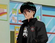 an anime character with green hair wearing a black jacket and looking at the camera while standing in front of a wall