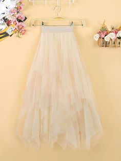 This is perfect for those who are looking for a clothing for a good price. It is fashionable, stylish, and it will look great on anyone who wears it. Do you wanahavit? Beige Ruffled Skirt For Parties, Tulle Tiered Mini Skirt For Spring, Tiered Tulle Mini Skirt For Spring, Spring Tiered Tulle Mini Skirt, Spring Season Tiered Tulle Mini Skirt, Beige Party Skirt With Ruffles, Beige Tulle Maxi Skirt For Party, Beige Flowy Skirt For Party, Summer Tulle Tiered Mini Skirt