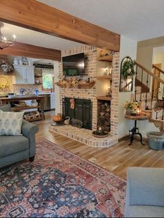 a living room filled with furniture and a fire place in the middle of a house