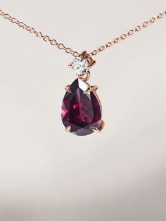 Necklace made of 14k rose gold with dark, red-violet drop and a diamond. Rhodolite gemstone will bring you energy, courage and joy in 2023. Elegant Ruby Necklace In Rose Gold, Elegant Rose Gold Ruby Necklace, Rose Gold Teardrop Ruby Jewelry, Rose Gold Pear-shaped Gemstone Necklaces, Rose Gold Pear-shaped Gemstone Necklace, Rose Gold Pear-shaped Ruby Jewelry, Elegant Pear-shaped Garnet Jewelry, Elegant Garnet Teardrop Pendant Jewelry, Elegant Teardrop Garnet Pendant Jewelry