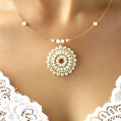 "I created this pearl pendant necklace by hand, using Swarovski pearls 3mm, Miyuki round seed beads, Miyuki Delica beads and 14k gold filled cable chain. * Measurements: Necklace length: 16.5\" (42cm) Pendant diameter: 1.18\" (3cm) * The necklace will come beautifully packaged for a gift. *All necklaces come with extension chain. *Additional information on the matching earrings you can see here: https://www.etsy.com/listing/218362925/long-pearl-earrings-pearl-bridal?ref=shop_home_active_3 * For Beaded Bridal Jewelry, Bridal Jewelry Pearl Sets, Swarovski Pearl Necklace, Bridal Jewelry Necklace, Long Pearl Earrings, Mandala Necklace, Bridal Pearl Necklace, Pearl Statement Necklace, Pearl Bridal Jewelry