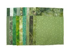 a patchwork quilt with different colors and patterns on it's sides, including green