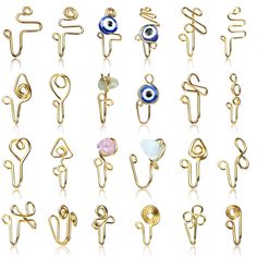 PRICES MAY VARY. Sufficient quantity: you will receive 24 pieces of nose cuff non piercings in one package, including evil eye nose cuff, bead nose cuff and wire nose cuff, rich in style, enough quantity and styles can meet your needs and replacement Note that there may be color differences Quality material: the African nose cuff is mainly made of stainless steel material, sturdy and quality, reliable and not easy to deform or break, the surface with delicate workmanship is not easy to fade or r African Nose, Clip On Nose Ring, Fake Nose Ring, Double Ear Piercings, Nose Cuff, Wire Jewelry Patterns, Dope Jewelry Accessories, Piercing Fake, Face Piercings