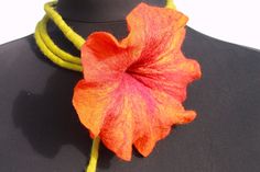 A very beautiful felted orange blossom with bourdauxfarbenen gradient as Filzkette. You can view the chain around his neck wear, but also as an ornament around the waist. Super well as the special jewelry for the bride. Very refined affects the flower necklace as a bracelet. Your imagination knows no bounds. The flower is orange with yellow gradient and the long stem is light green. The colors are beautiful, you'll be amazed. Size / Weight / Dimensions Length of the stem with flower 70,8 inch Fl Handmade Orange Flower Necklace, Unique Orange Flower Shaped Jewelry, Unique Orange Flower-shaped Jewelry, Handmade Orange Flower Pendant Necklace, Handmade Orange Necklace With Flower Pendant, Wool Necklace, Yellow Gradient, Felt Necklace, Hippie Necklace