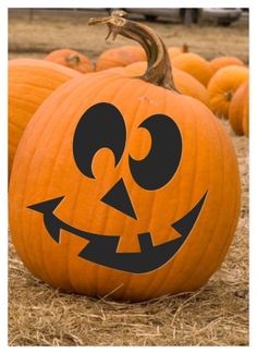 pumpkins with faces carved into them sitting in the middle of some dry grass and straw